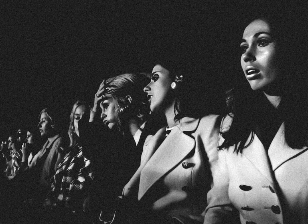 group of people in vintage cinema clothes
